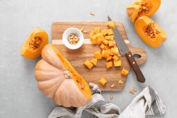 Fresh Raw Sliced Butternut Squash On Wooden Board, Top Down View