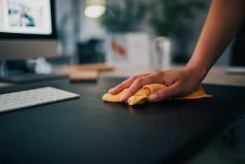 Cleaning Desk In The Office, Close Up.