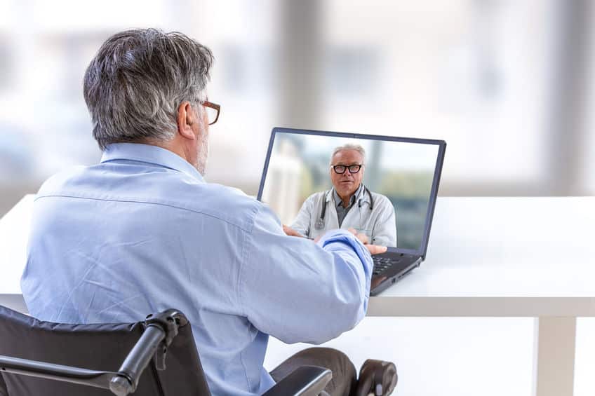 Doctor Comforting A Disabled Patient