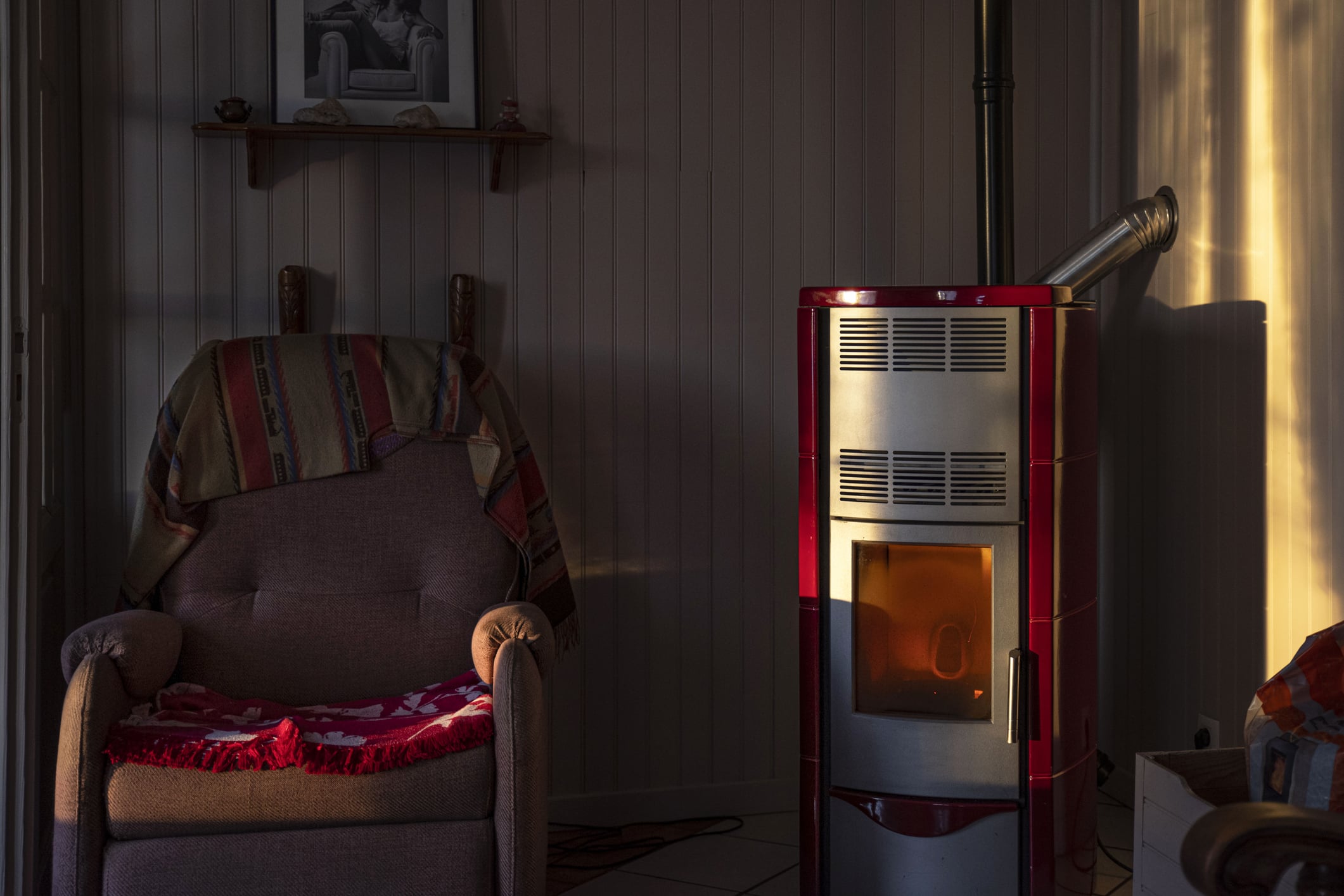 Wood Stove And Armchair In A House