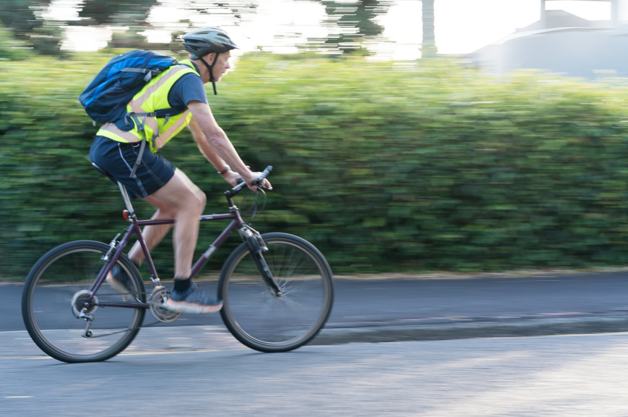 Cyclist In Suburban Street