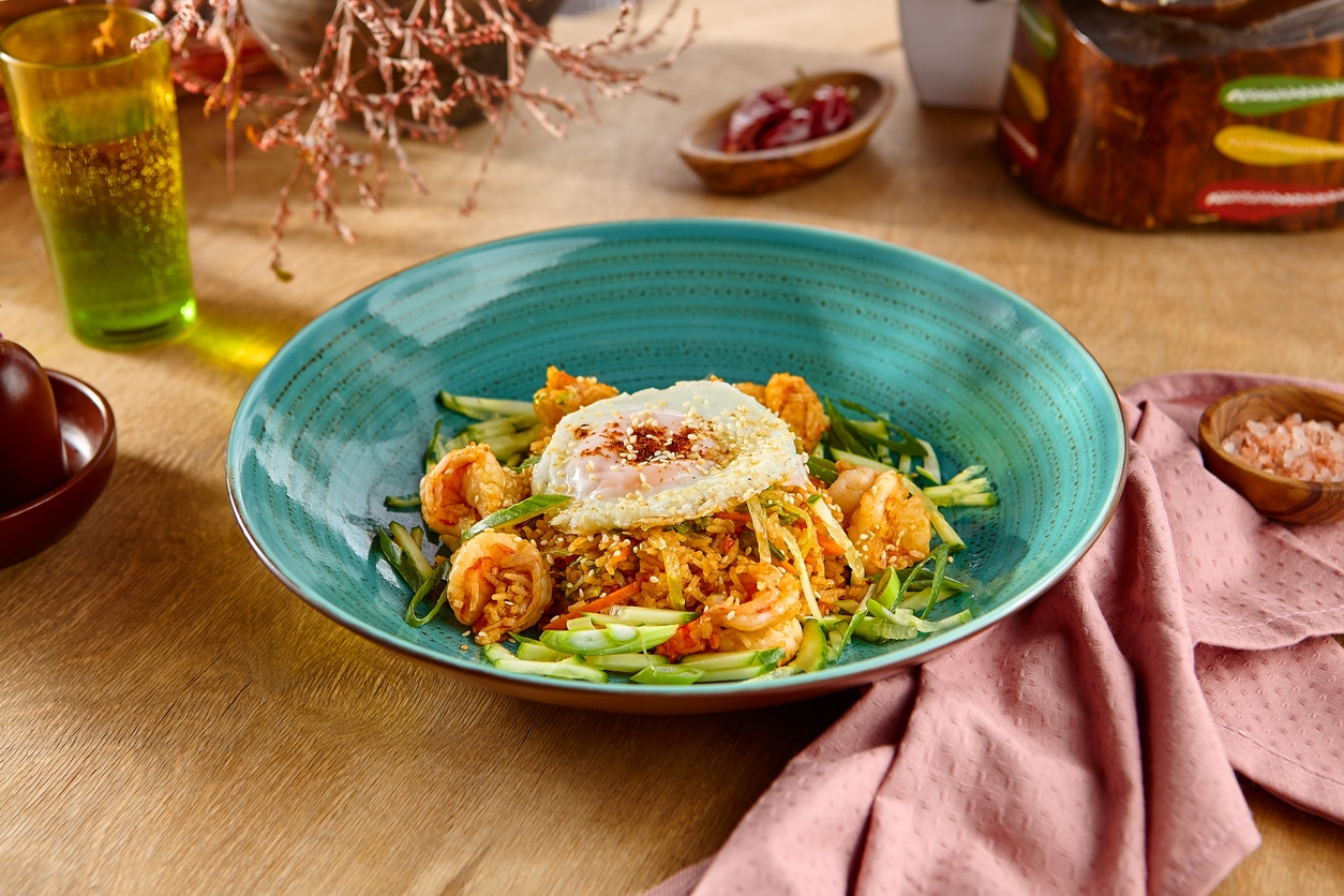 Delicious Shrimp And Egg Fried Rice In A Vibrant Plate, Perfect For Asian Cuisine Lovers